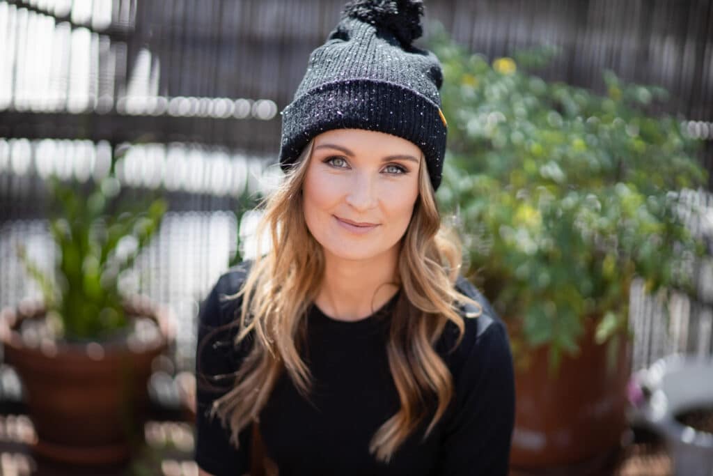 casual female with beanie hat in outdoor setting